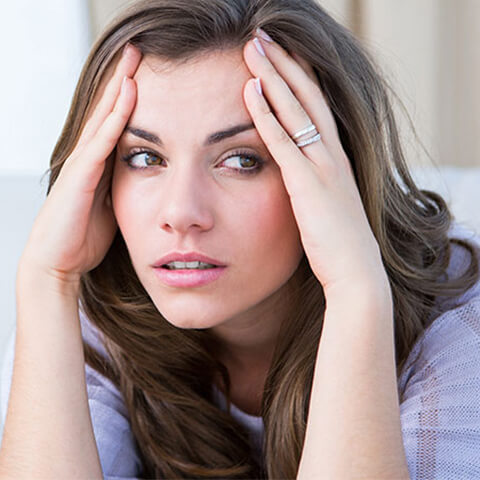 Woman with a jaw-pain headache